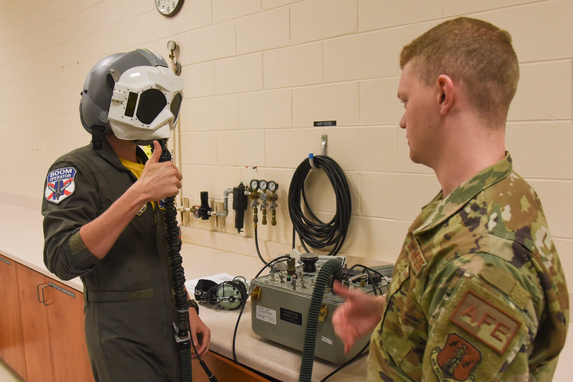Members of the 117th Aircrew Flight Equipment (AFE) office trains Aircrew on equipment at Sumpter Smith Joint National Guard Base, Alabama, Dec. 2, 2023. The aircrew were training on equipment to shield their eyes in the event of a bright flash. (U.S. Air National Guard photo by Staff Sgt Nicholas Faddis)