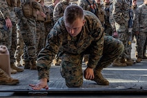 U.S. Marine Corps 2nd Lt. Daniel McNeill, an intelligence officer with Combat Logistics Battalion 4, Combat Logistics Regiment 3, 3rd Marine Logistics Group, plots a point on a map for a convoy displacement brief during Stand-in Force Exercise 24 at the Eastern Fuji Maneuver Area on Combined Arms Training Center Camp Fuji, Dec. 3, 2023. SIFEX 24 is a division-level exercise involving all elements of the Marine Air-Ground Task Force focused on strengthening multi-domain awareness, maneuver, and fires across a distributed maritime environment. This exercise serves as a rehearsal for rapidly projecting combat power in defense of allies and partners in the region. (U.S. Marine Corps photo by Cpl. Paley Fenner)
