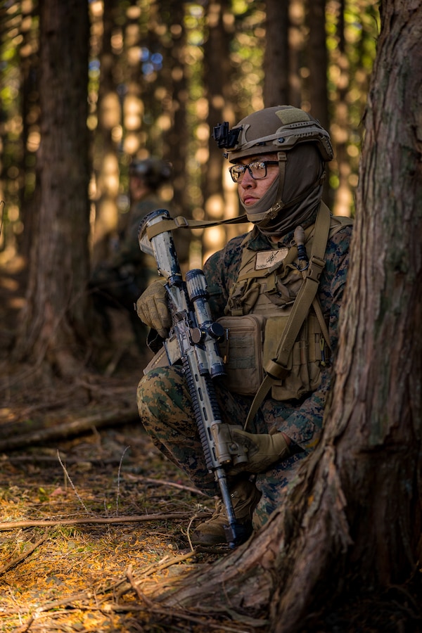 U.S. Marine Corps Lance Cpl. Orin Chacho provides security during Stand-in Force Exercise 24 at Combined Arms Training Center Camp Fuji, Japan, Dec. 4, 2023. SIFEX 24 is a division-level exercise involving all elements of the Marine Air-Ground Task Force focused on strengthening multi-domain awareness, maneuver, and fires across a distributed maritime environment. This exercise serves as a rehearsal for rapidly projecting combat power in defense of allies and partners in the region. Chacho, a native of Thoreau, New Mexico is a rifleman with 2d Battalion, 7th Marine Regiment. 2/7 is forward deployed in the Indo-Pacific under 4th Marine Regiment, 3d Marine Division as part of the Unit Deployment Program. (U.S. Marine Corps photo by Lance Cpl. Matthew Morales)
