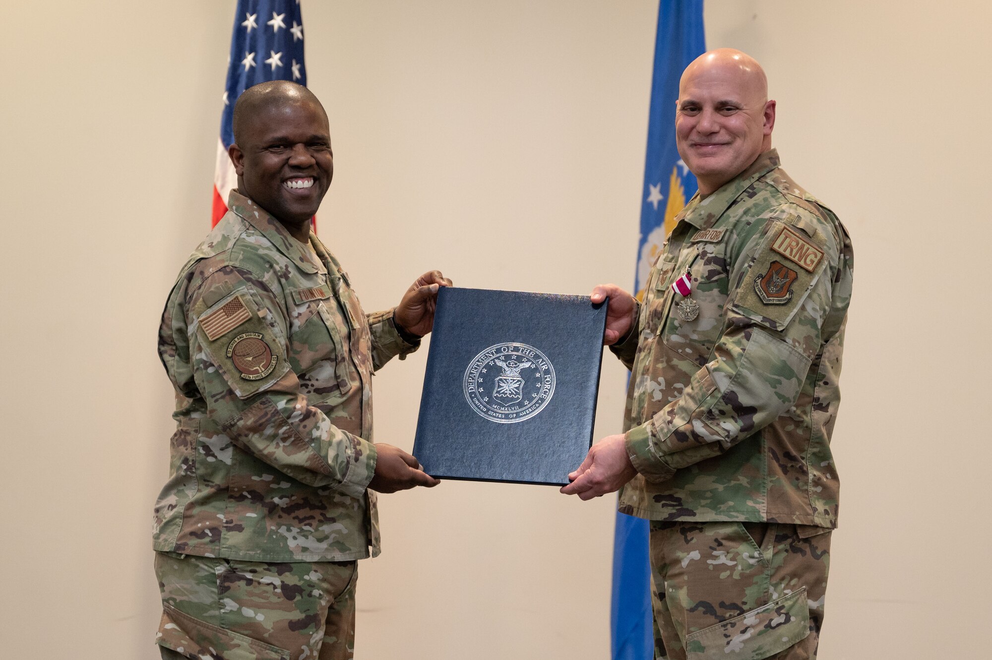 Fountain and Blanchard hold a certificate together