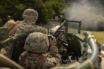 U.S. Marine Corps Cpl. Zachary Posey, left a heavy equipment mechanic, and Cpl. Jacob Benton, right, an automotive maintenance technician, both with 3rd Maintenance Battalion, 3rd Marine Logistics Group, fire a M2 Browning .50 Caliber machine gun at Camp Hansen, Okinawa, Japan, Dec. 22, 2023. The reason for the training was to increase their lethality, survivability, and capability when it comes to employing the M2 .50 Caliber machine gun in a mounted platform. (U.S. Marine Corps photo by Lance Cpl. Weston Brown)