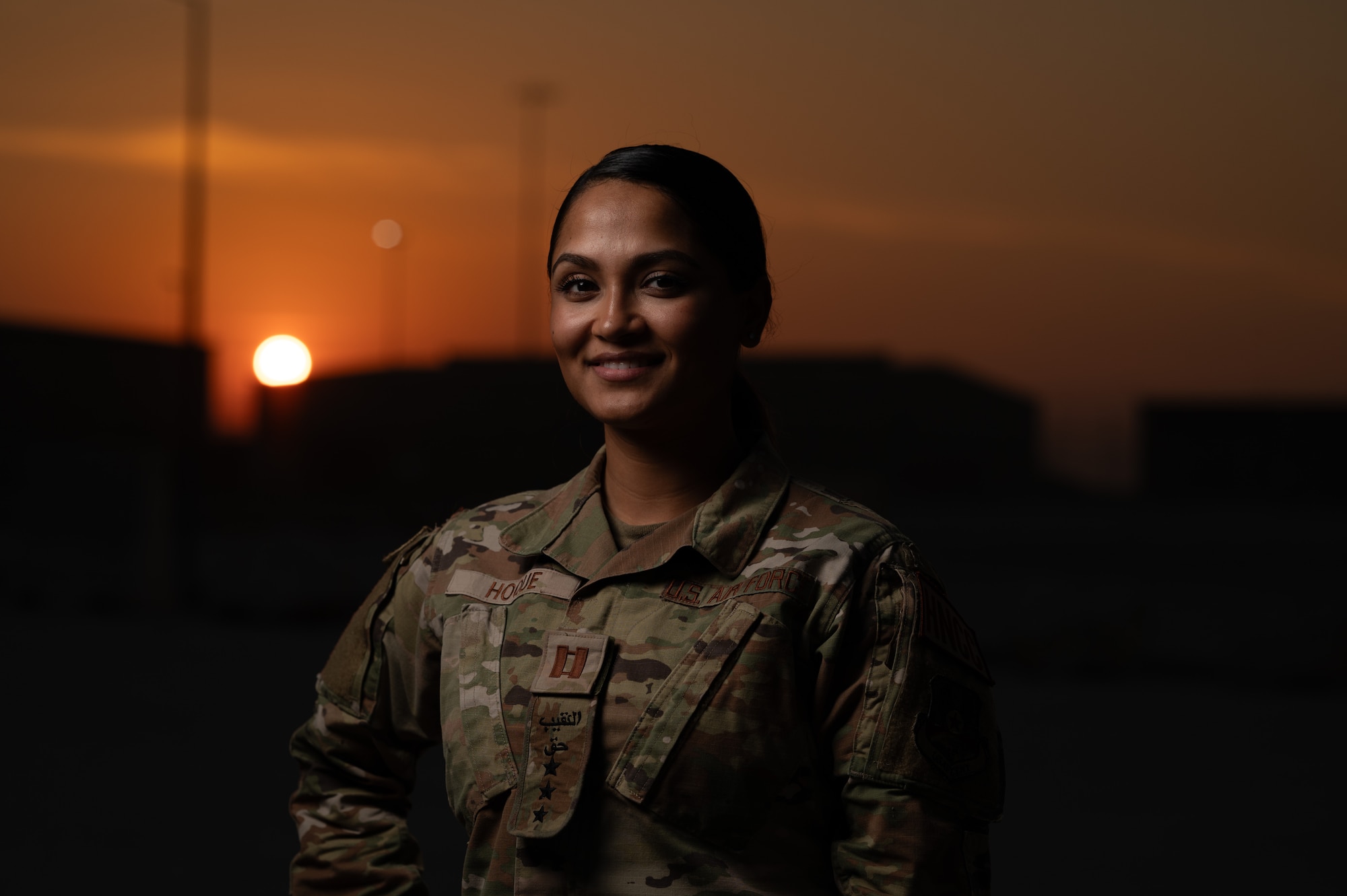 U.S. Air Force Capt. Nahima Hoque, Host Nation Coordination Cell Plans and Programs officer in charge and Public Health flight commander, poses for a photo at an undisclosed location in the U.S. Central Command area of responsibility, Dec. 08, 2023. Hoque is a Language Enable Airman Program scholar working with HNCC to provided Arabic translation services and cultural advice between base and host nation leaders. (U.S. Air Force photo by Airman 1st Class Stassney Davis)