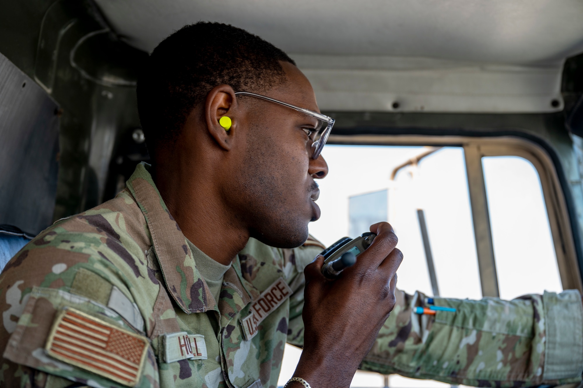 U.S. Air Force Airman 1st Class Kareem Howell, a fuels management specialist, communicates with his dispatch after refueling a C-17 Globemaster III at an undisclosed location in the U.S. Central Command area of responsibility, Dec. 13, 2023. After arriving to the U.S., Howell lived with his mother in New York where he also attended college studying business while working at John F. Kennedy Airport supplying aircraft with catering. Being surrounded by aircraft every day, Howell discovered a growing passion for aviation, inspiring him to pursue a career a pilot in the U.S. Air Force. (U.S. Air Force photo by Staff Sgt. Lawrence Sena)