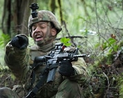 Washington National Guard Soldiers with Bravo Company, 3rd Battalion, 161st Infantry Regiment, 81st Stryker Brigade Combat Team, react to contact during squad training on Joint Base Lewis-McChord Jan. 6, 2024. By practicing excellence in the basics, Infantrymen are ready for any mission, local or abroad.