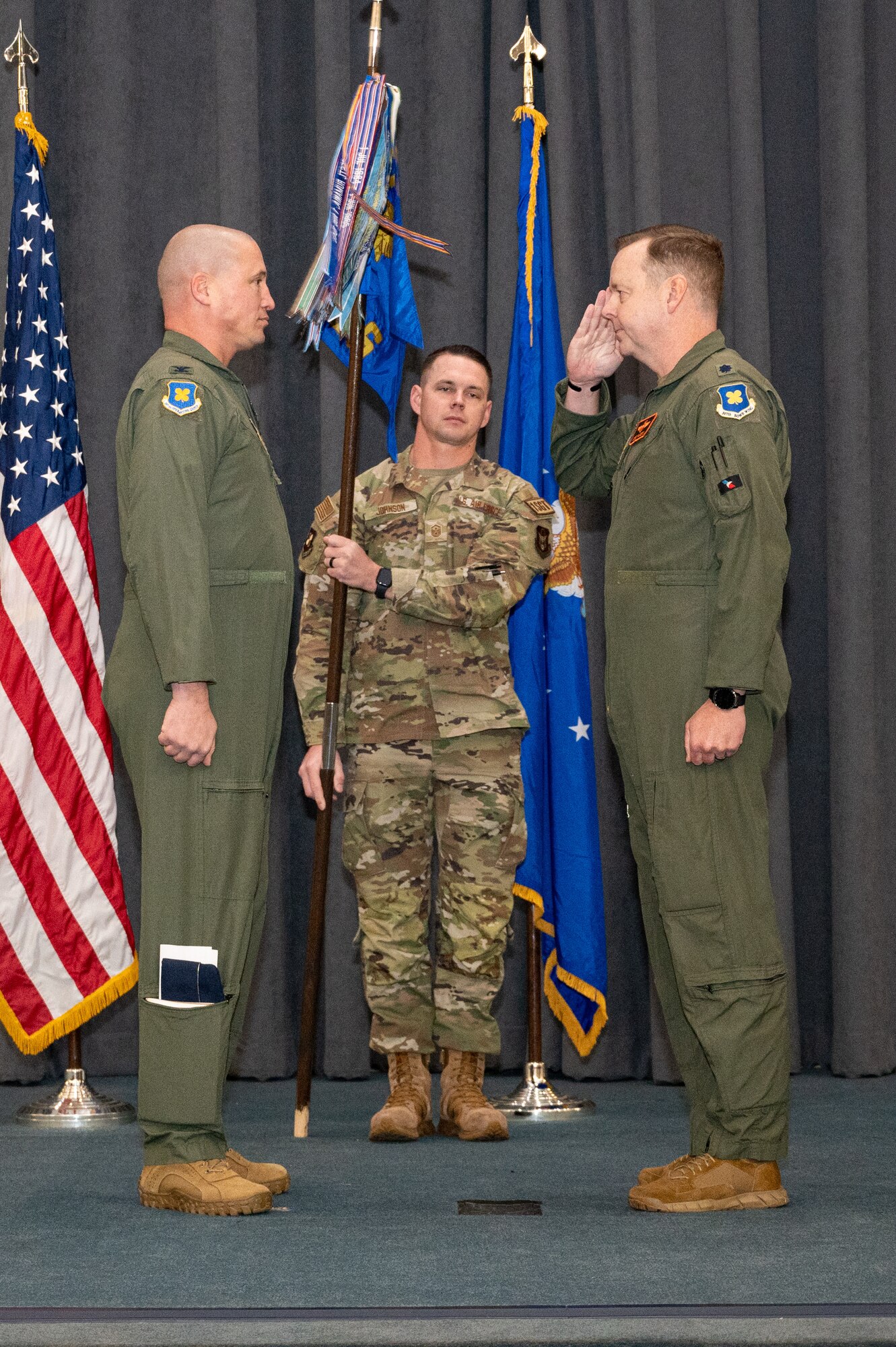 Photo of Airman saluting another Airman