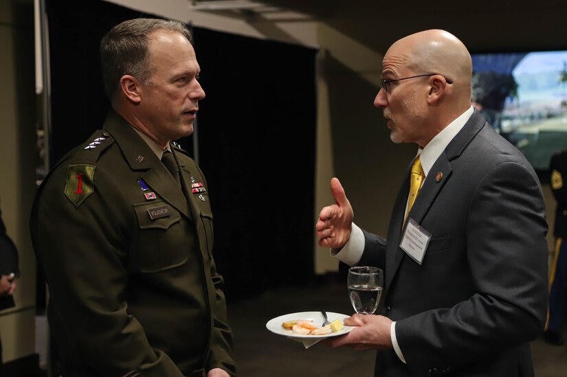 Lt. Gen. John Kolasheski, V Corps commanding general, speaks with Jim Iacocca, president/CEO of the Knox Development Alliance, during the New Year Reception held Jan. 7 at the General George Patton Museum on Fort Knox. The event, held annually, informs the local community about corps activities and thanks installation Soldiers, civilians and family members as well as community partners for their support.  (U.S. Army photo by Sgt. Javen Owens)