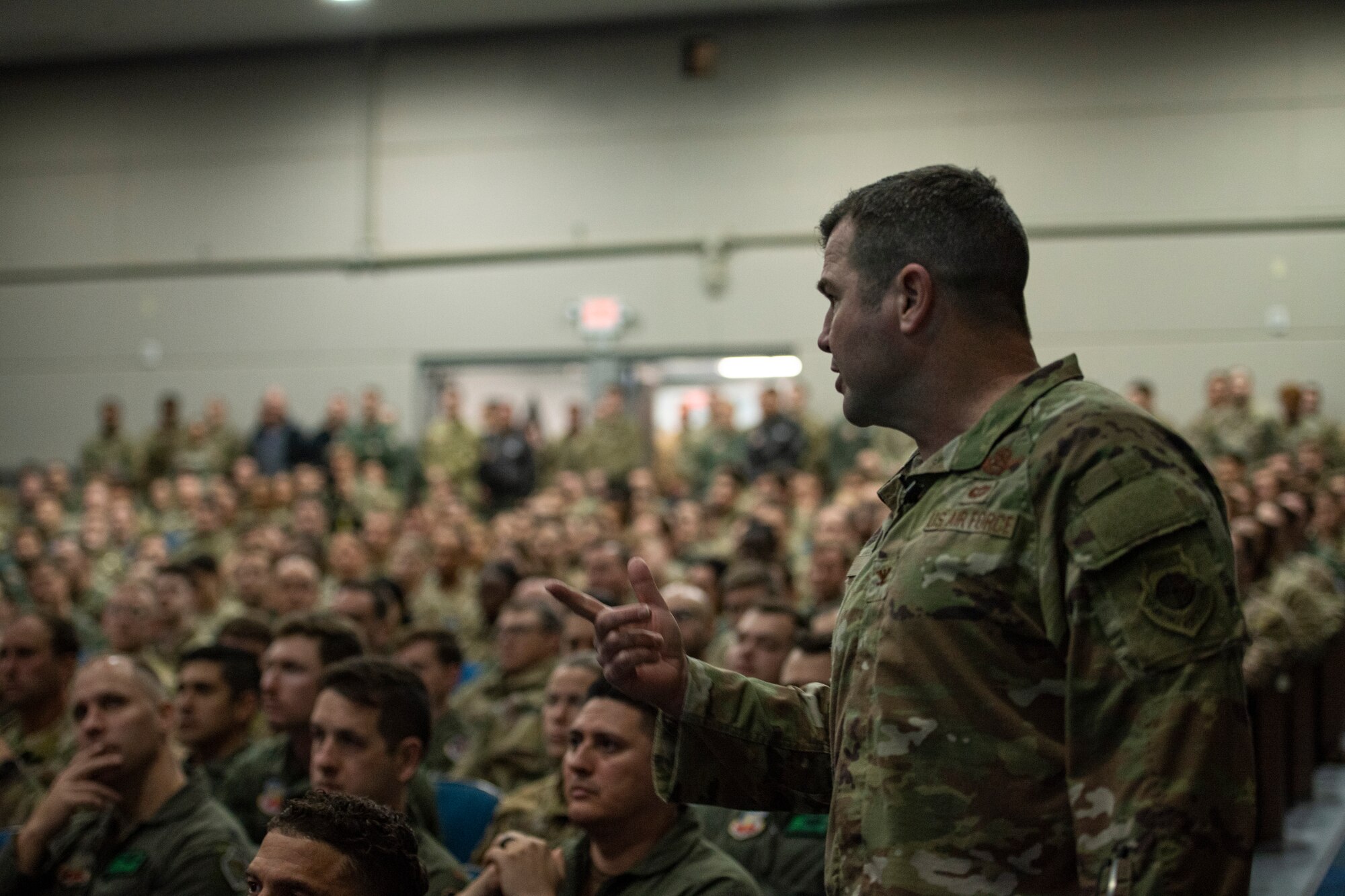 U.S. Air Force Chief Master Sgt. Just Geers, 23rd Wing command chief, speaks to Airmen during an all call at Moody Air Force Base, Georgia, Jan. 3, 2024. Geers spoke to Airmen about his professional and personal goals heading into the new year. (U.S. Air Force photo by Airman 1st Class Whitney Gillespie)