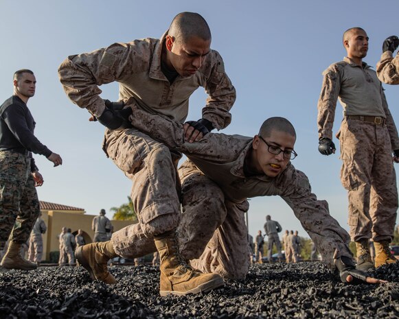 U.S. Marine Corps recruits with Echo Company , 2nd Recruit Training Battalion, execute MCMAP techniques at Marine Corps Recruit Depot San Diego, Dec. 28, 2023. MCMAP aims to strengthen the mental and moral resiliency of recruits and Marines through realistic combative training, warrior ethos studies, and physical hardening. (U.S. Marine Corps photo by Lance Cpl. Sarah M. Grawcock)