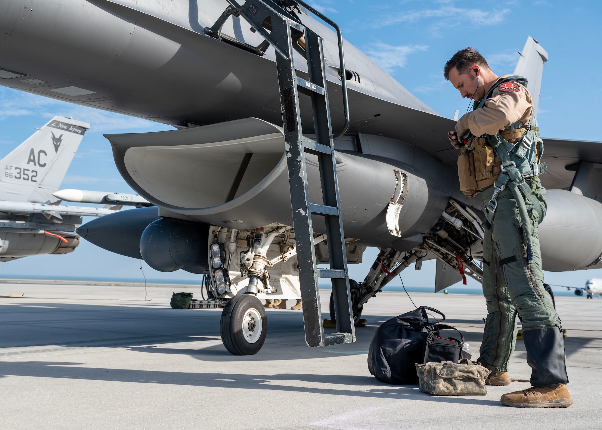 Capt. Shapleigh, an F-16 Fighting Falcon pilot, prepares to board an F-16 during Exercise Ballast Cannon 24.3.
