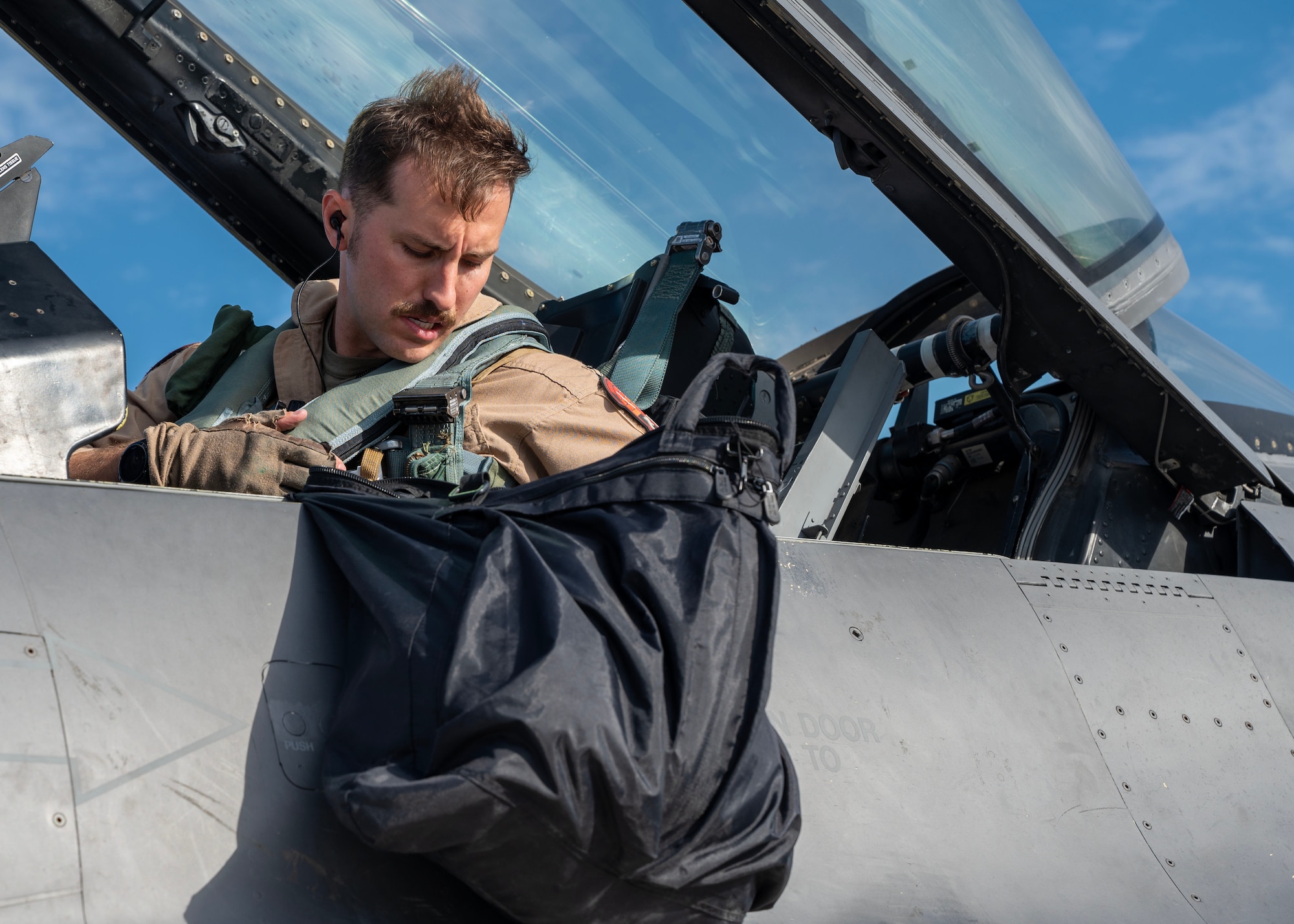 Capt. Shapleigh, an F-16 Fighting Falcon pilot, conducts a preflight check during Exercise Ballast Cannon 24.3.