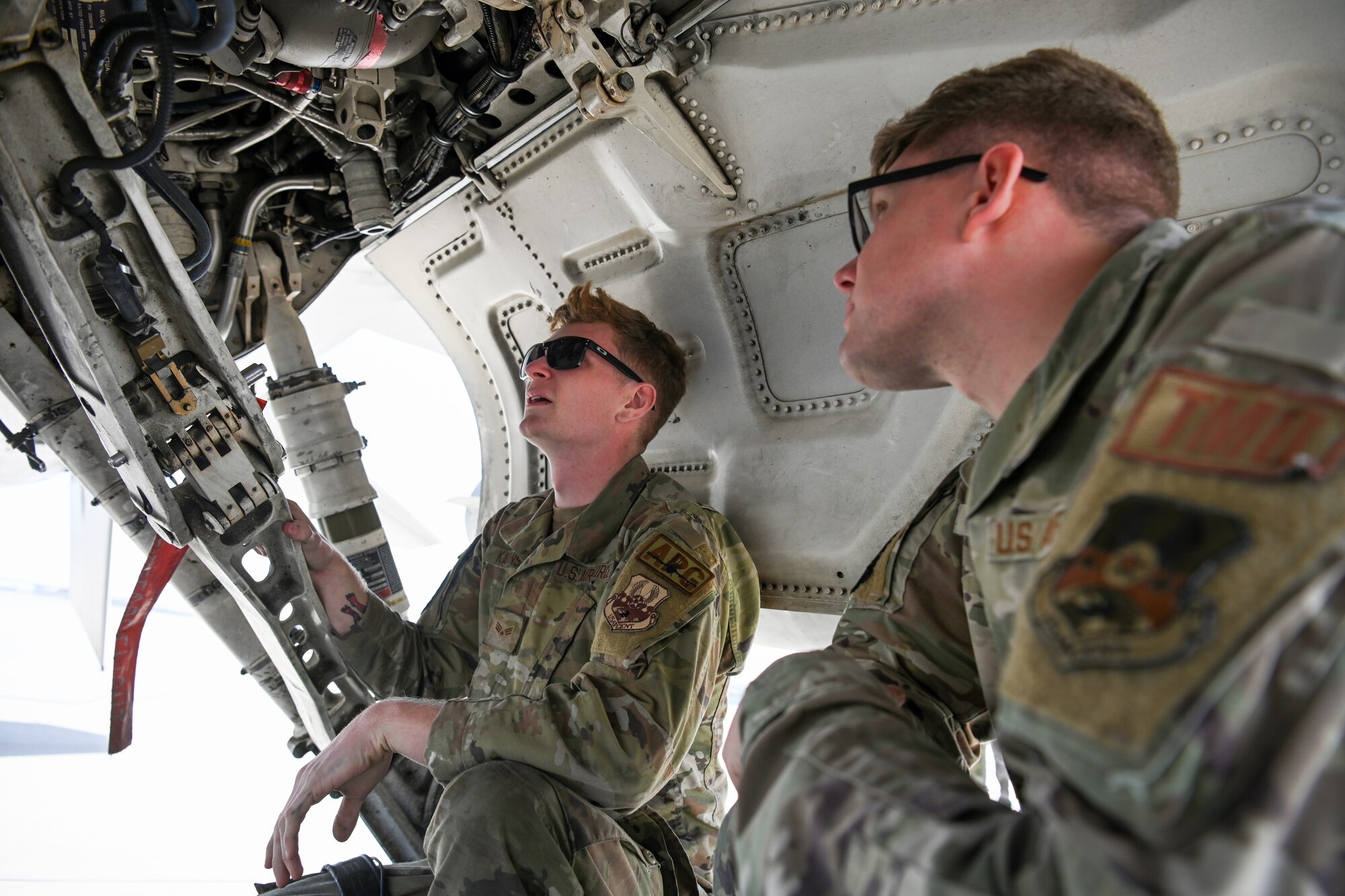 SrA Miller, right, a Traffic Management Craftsman, receives multi-capable Airman training from SrA Kaminski, left, a crew chief, during Exercise Ballast Cannon 24.3.