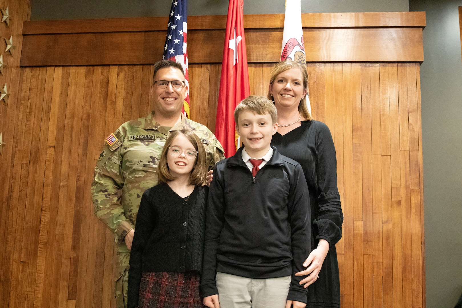 Lt. Col. Nicholas Krzensinki, staff officer in the Illinois Army National Guard Headquarters’ Plans, Operations, and Training Directorate (G3) poses with his family after his promotion ceremony at the Illinois Military Academy on Camp Lincoln in Springfield on Jan. 4.