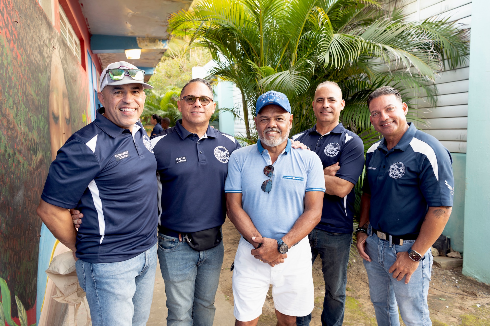 Members of the 156th Wing Chiefs Council, Puerto Rico Air National Guard, and Retired U.S. Air Force Master Sgt. Juan C. Diaz, former PRANG Airman, center, pose for a photo during a Three Kings eve event at Loiza, Puerto Rico, Jan. 5, 2024. For 48 consecutive years, the PRANG has honored a Puerto Rican tradition, Three Kings Day, by impacting the Piñones community through a yearly event where the 156th Wing Chiefs Council and U.S. Airmen partnered with local non-profit organizations to impact hundreds of children with ages ranging from newborn to 12-years-old, during the eve of Three Kings Day. (U.S. Air National Guard photo by Airman 1st Class Sharymel Montalvo Velez)