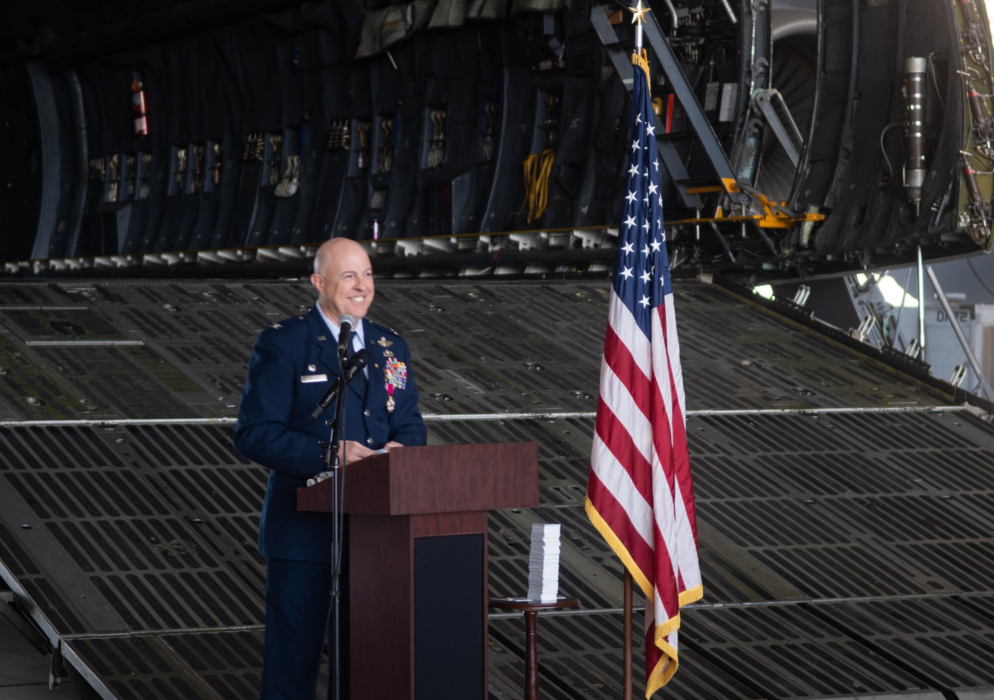Col. James C. Miller, retired 433rd Operations Group commander, addresses an audience during a retirement ceremony