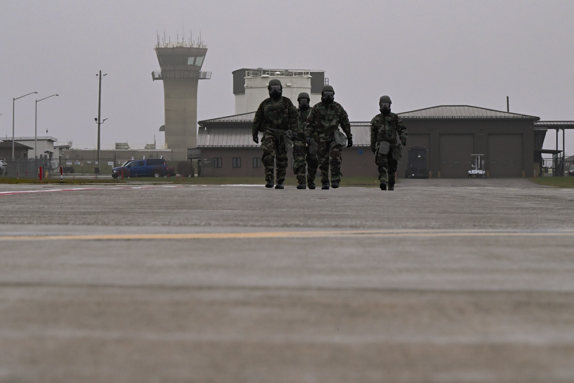 Reserve Citizen Airmen assigned to the 910th Airlift Wing walk on the flightline during a Chemical, Biological, Radiological, Nuclear and high-yield Explosives response exercise at Youngstown Air Reserve Station, Ohio, Dec. 3, 2023.