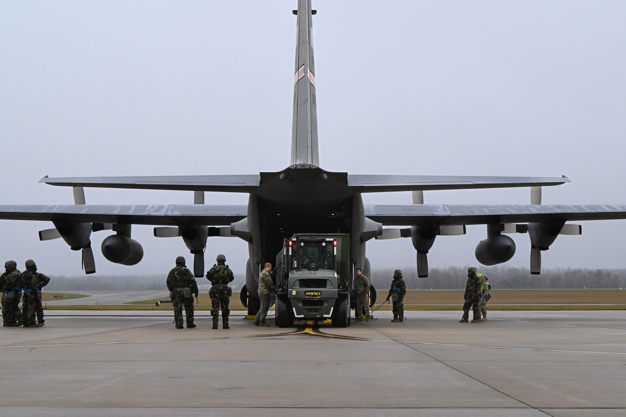 Reserve Citizen Airmen assigned to the 910th Airlift Wing prepare to offload cargo from a C-130H Hercules aircraft during a Chemical, Biological, Radiological, Nuclear and high-yield Explosives response exercise at Youngstown Air Reserve Station, Ohio, Dec. 3, 2023.