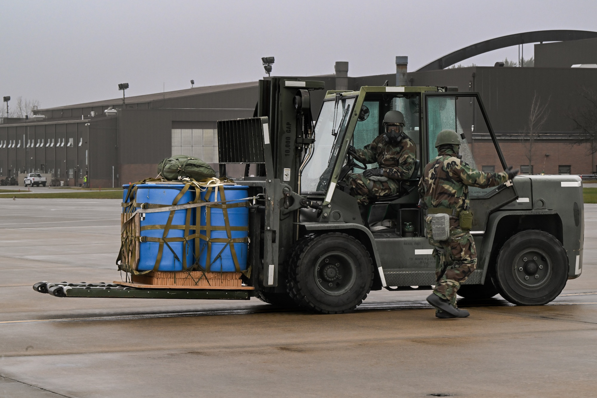 Reserve Citizen Airmen assigned to the 910th Airlift Wing offload cargo from a C-130H Hercules aircraft during a Chemical, Biological, Radiological, Nuclear and high-yield Explosives response exercise at Youngstown Air Reserve Station, Ohio, Dec. 3, 2023.