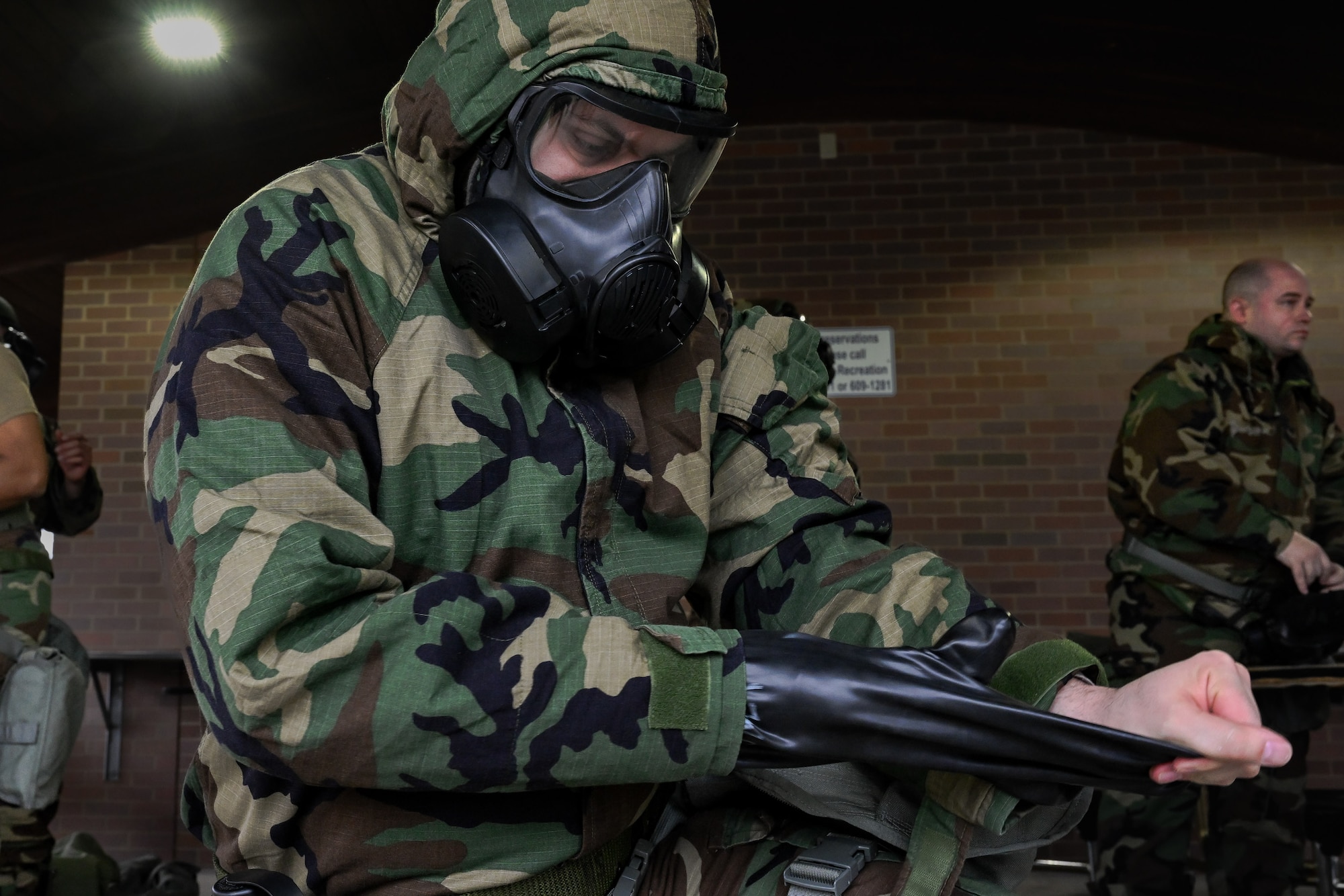 A Reserve Citizen Airman assigned to the 910th Medical Squadron removes personal protective equipment during a Chemical, Biological, Radiological, Nuclear and high-yield Explosives response exercise at Youngstown Air Reserve Station, Ohio, Dec. 3, 2023.
