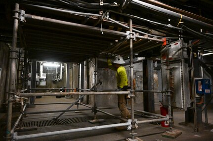A member in support of the Joint Task Force-Red Hill (JTF-RH) sets up scaffolding at the Red Hill Bulk Fuel Storage Facility (RHBFSF), Halawa, Hawaii, Jan. 4, 2024.