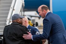 A photo of two men shaking hands.