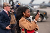 A photo of people using cameras.