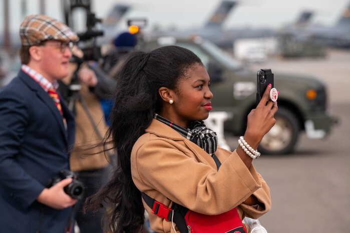 A photo of people using cameras.
