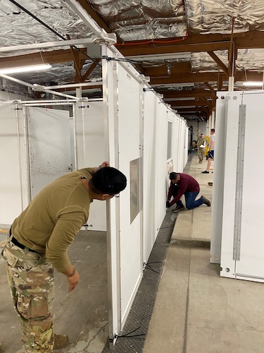 Members of the 21st Security Force Squadron construct a new shoot house at Peterson Space Force Base, Colorado, Dec. 12, 2023. The new shoot house was constructed to enhance the training capabilities for the 21st SFS and enable defenders to be better prepared for difficult real-life situations. (Courtesy photo)
