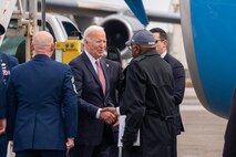 A photo of President Biden greeting people.