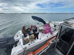 A Coast Guard law enforcement team terminates an illegal small passenger vessel for hire operating in Anna Maria Sound off Anna Maria Island, Thursday, Jan. 4, 2023. A Coast Guard Station Cortez boarding team boarded a 22-foot boat with two people and three dogs as passengers. (U.S. Coast Guard photo)