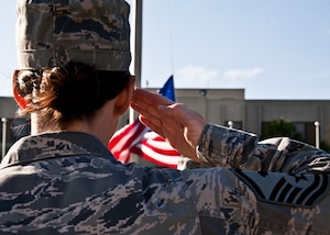 A first sergeant salutes the flag during a retreat ceremony conducted at Eglin Air Force Base, Fla.