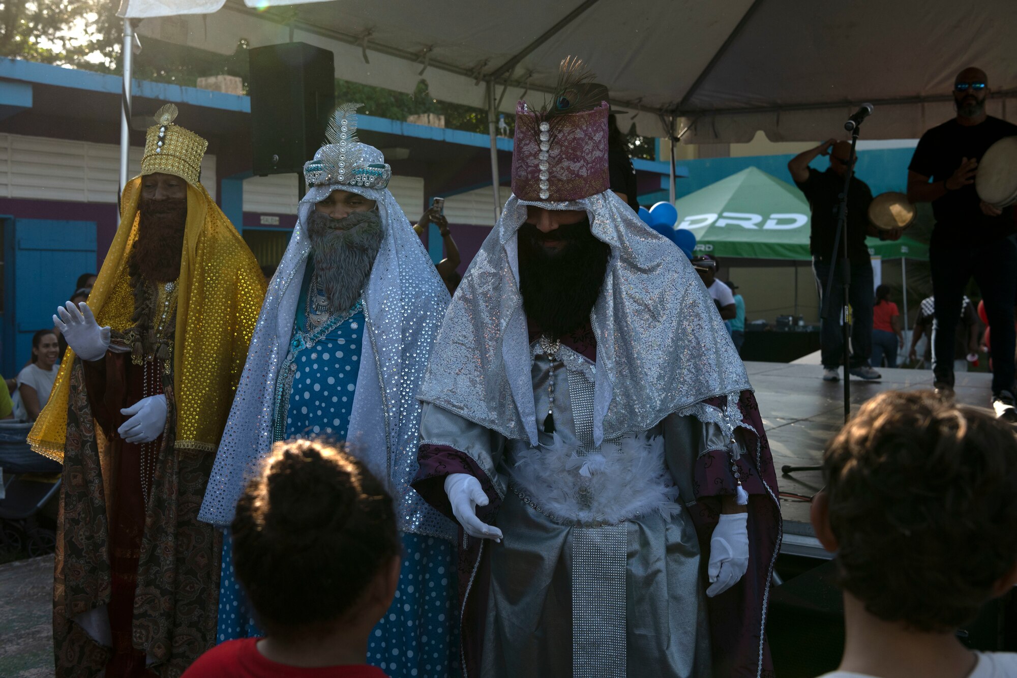 The Three Kings interact with children during a Three Kings eve event at Loiza, Puerto Rico, Jan. 5, 2024. For 48 consecutive years, the Puerto Rico Air National Guard has honored a Puerto Rican tradition, Three Kings Day, by impacting the Piñones community through a yearly event where the 156th Wing Chiefs Council and U.S. Airmen partnered with local non-profit organizations to impact hundreds of children with ages ranging from newborn to 12-years-old, during the eve of Three Kings Day. (U.S. Air National Guard photo by Airman 1st Class Sharymel Montalvo Velez)
