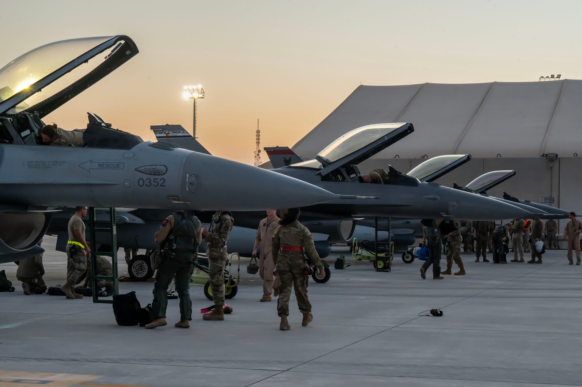 U.S. Air Force F-16 Fighting Falcons pilots and crew chiefs conduct post-flight operations at an undisclosed location in the U.S. Central Command area of responsibility, Jan. 6, 2024.