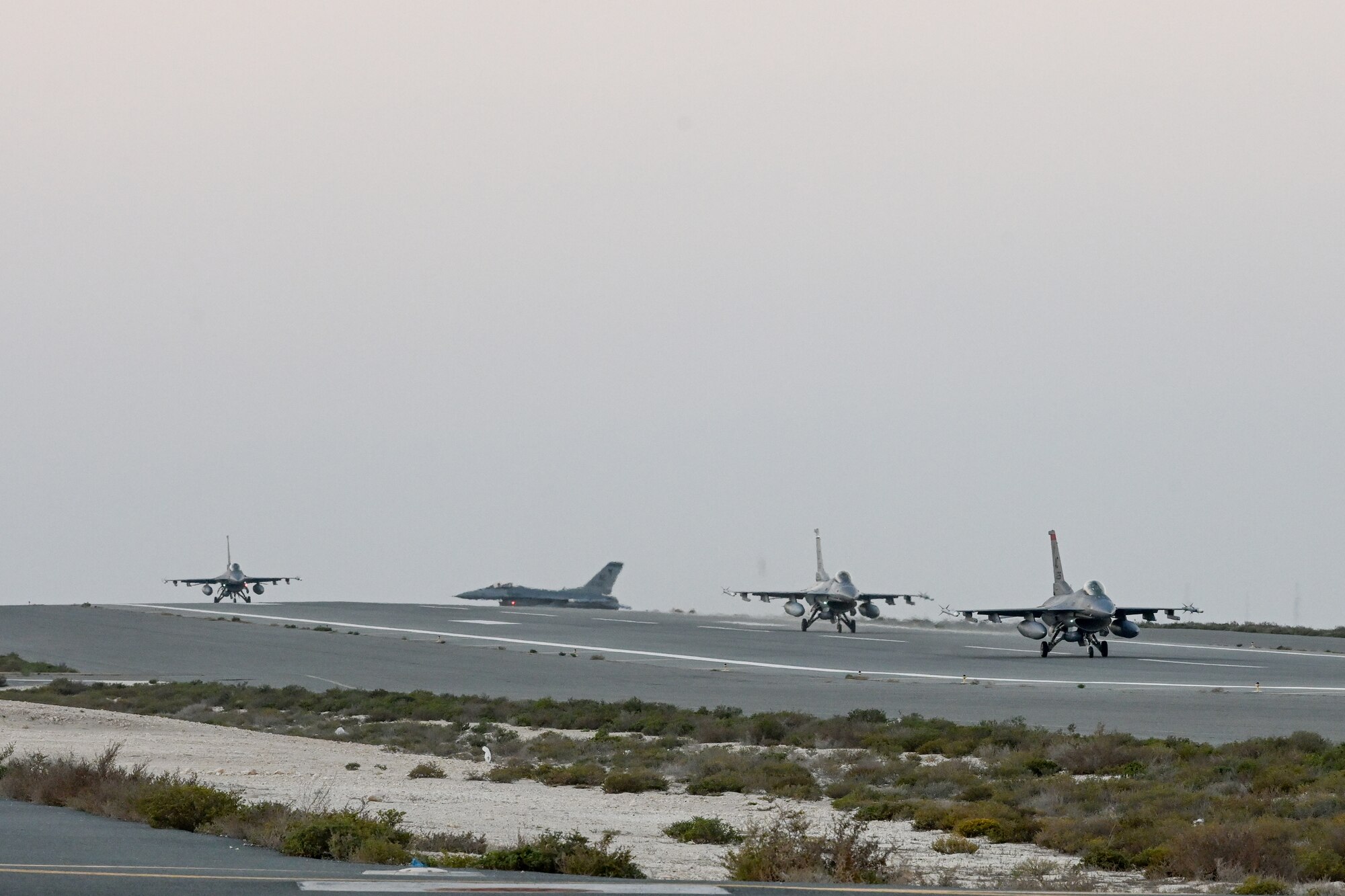U.S. Air Force F-16 Fighting Falcons taxis at an undisclosed location in the U.S. Central Command area of responsibility in preparation for Exercise Ballast Cannon, Jan. 6, 2024.