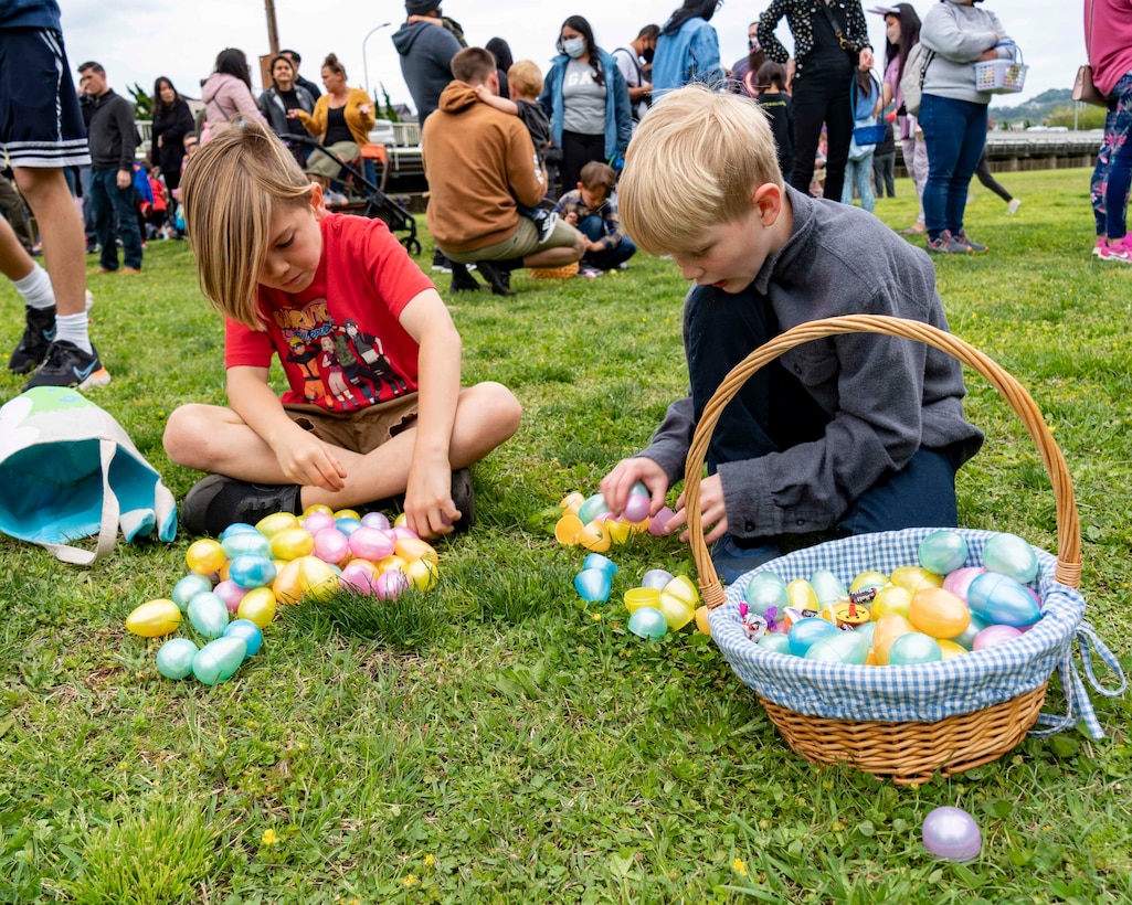 Children celebrate Easter Sunday by participating in an egg hunt