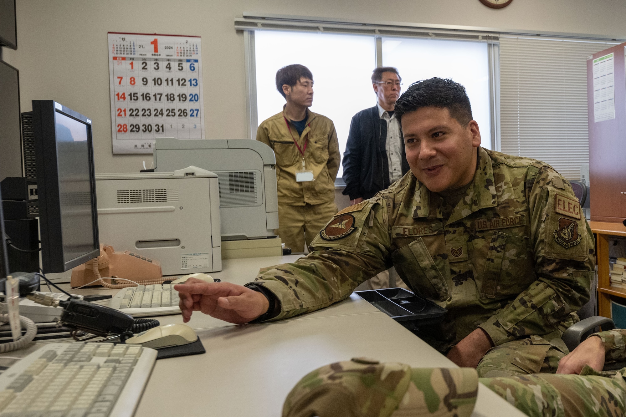 U.S. Air Force Technical Sgt. Enrique Flores, Non-Commissioned Officer in Charge of the 35th Civil Engineering Squadron electrical systems flight, demonstrates Supervisory Control and Data Acquisition (SCADA) during a Wild Weasel Walk-through at Misawa Air Base, Japan.