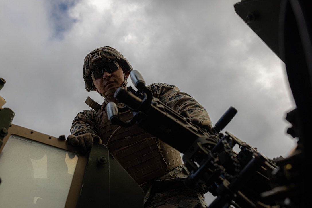 U.S. Marine Corps Cpl. Isaac Lopezgamboa, water support technician with 3rd Maintenance Battalion, 3rd Marine Logistics Group, prepares to dismount a M2 Browning .50 Caliber machine gun from a Joint Light Tactical Vehicle at Camp Hansen, Okinawa, Japan, Dec. 22, 2023. The reason for the training was to increase their lethality, survivability, and capability when it comes to employing the M2 .50 Caliber machine gun in a mounted platform. (U.S. Marine Corps photo by Lance Cpl. Weston Brown)