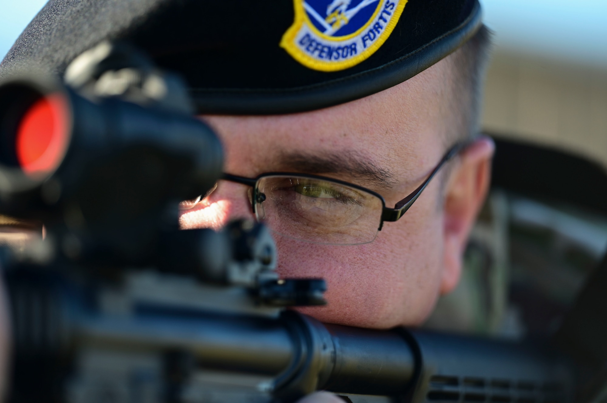 U.S. Air Force Master Sgt. Eric Emerson, 17th Security Forces Squadron standardization and evaluation superintendent, aims a rifle, Goodfellow Air Force Base, Texas, Dec. 5, 2023. Before joining the military, Emerson wanted to pursue a career in law enforcement. When he was cut from the San Angelo Police Department hiring process, he enlisted as a security forces specialist. (U.S. Air Force photo by Airman 1st Class Madison Collier)