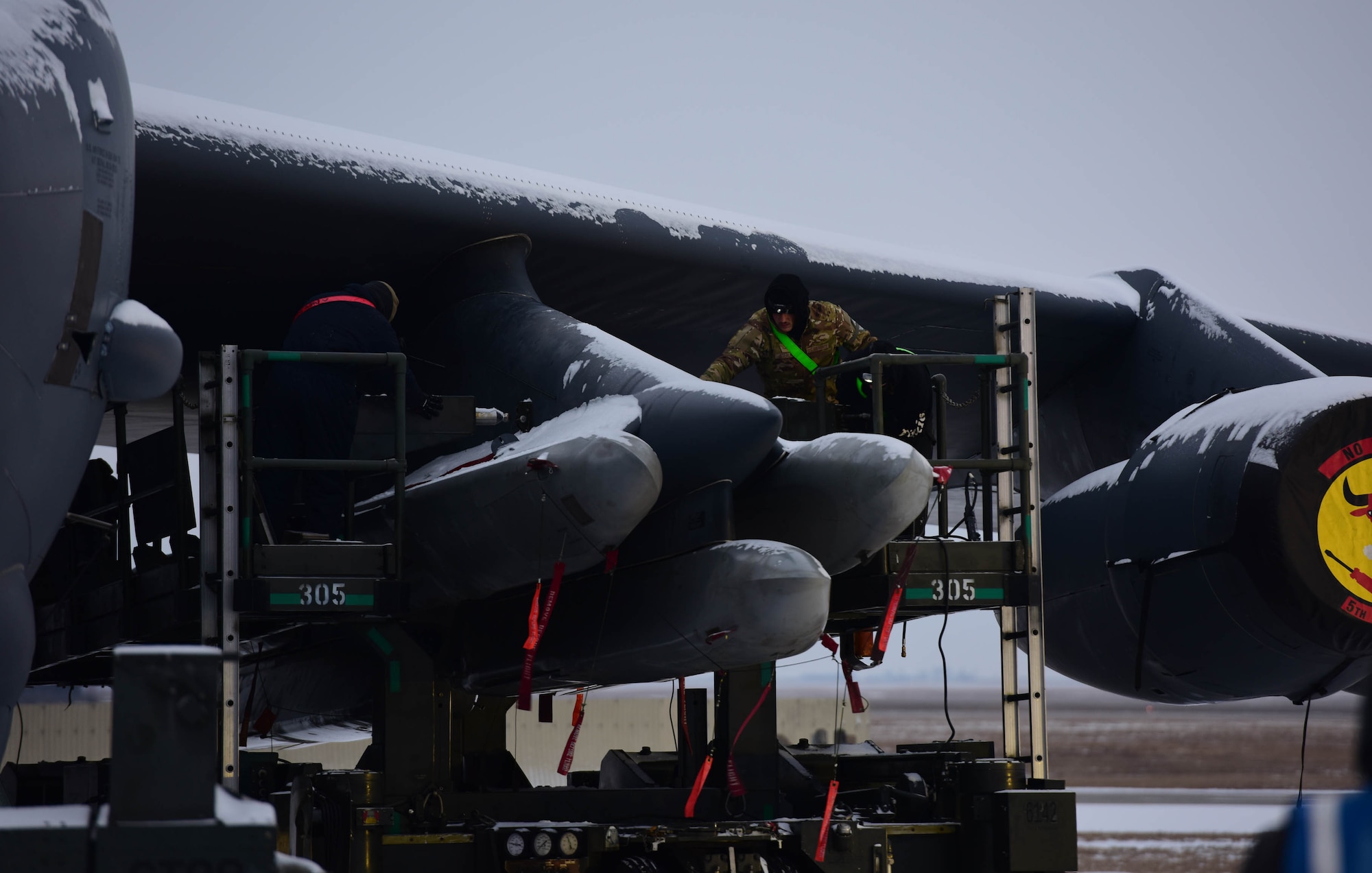 Members of Team Minot load a Air-Launched Cruise Missiles onto a B-52H Stratofortress during operation Prarie/Bayou Vigilance 24-2 at Minot Air Force Base, North Dakota Dec. 6, 2024. As routine training missions, the vigilance series ehances the safety, security, and reliability of the bomber leg of the U.S. nuclear triad. (U.S. Air Force photo by Airman 1st Class Luis Gomez)