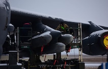 Members of Team Minot load a Air-Launched Cruise Missiles onto a B-52H Stratofortress during operation Prarie/Bayou Vigilance 24-2 at Minot Air Force Base, North Dakota Dec. 6, 2024. As routine training missions, the vigilance series ehances the safety, security, and reliability of the bomber leg of the U.S. nuclear triad. (U.S. Air Force photo by Airman 1st Class Luis Gomez)