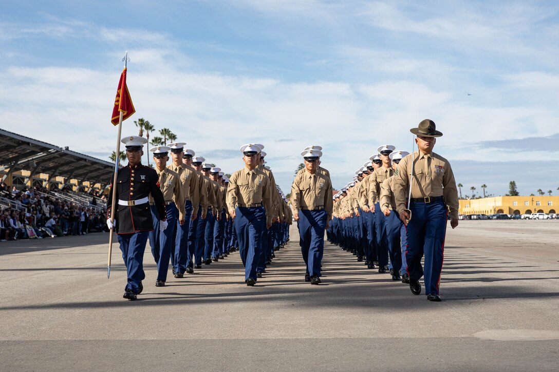 U.S. Marines with Lima Company, 3rd Recruit Training Battalion, march in formation during a graduation ceremony at Marine Corps Recruit Depot San Diego, Dec. 20, 2023. Graduation took place at the completion of the 13-week transformation process, which included training for drill, marksmanship, basic combat skills, and Marine Corps customs and traditions. (U.S. Marine Corps photo by Lance Cpl. Sarah M. Grawcock)