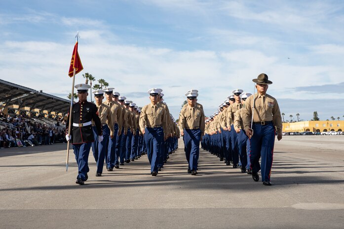 U.S. Marines with Lima Company, 3rd Recruit Training Battalion, march in formation during a graduation ceremony at Marine Corps Recruit Depot San Diego, Dec. 20, 2023. Graduation took place at the completion of the 13-week transformation process, which included training for drill, marksmanship, basic combat skills, and Marine Corps customs and traditions. (U.S. Marine Corps photo by Lance Cpl. Sarah M. Grawcock)