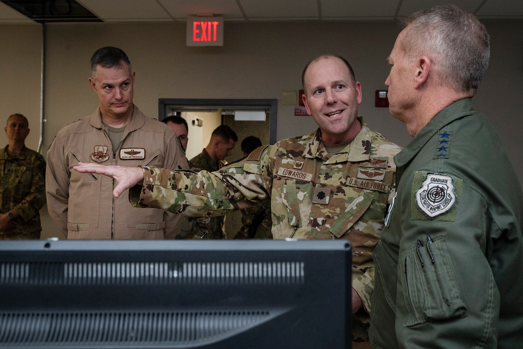 Lt. Col. Kevin Edwards, 609th Air Support Squadron commander, briefs Gen. Mark Kelly, commander of Air Combat Command, on the 609th Air Operations Center’s mission.