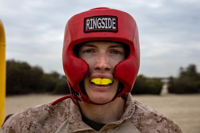 U.S. Marine Corps Recruit Benjamin Henderson, a Bradford, Illinois native with Echo Company, 2nd Recruit Training Battalion, prepares for a body sparring event at Marine Corps Recruit Depot San Diego, Dec. 18, 2023. Recruits executed Martial Corps Martial Arts Program techniques throughout body sparring teaching them self-defense and instilling a combat warrior mindset. (U.S. Marine Corps photo by Lance Cpl. Sarah M. Grawcock)