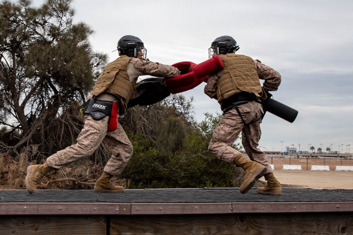 U.S. Marine Corps recruits with Echo Company, 2nd Recruit Training Battalion, participate in a pugil sticks event at Marine Corps Recruit Depot San Diego, Dec. 18, 2023. Recruits executed Marine Corps Martial Arts Program techniques throughout pugil sticks teaching them self-defense and instilling a combat warrior mindset. (U.S. Marine Corps photo by Lance Cpl. Sarah M. Grawcock)