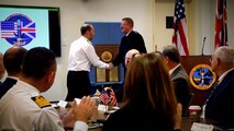 Rear Admiral Robbie Lauchlan, Royal Navy Chief Strategic Systems Executive, shakes hands with Vice Admiral Johnny Wolfe, Director Strategic Systems Programs. Lauchlan presented Wolfe with a plaque to commemorate the 200th meeting of the U.S.-UK Joint Steering Task Group when the group met on 14 December at Strategic Weapons Facility Atlantic, in Kings Bay, Georgia. The Joint Steering Task Group, established in 1963 under the Polaris Sales Agreement, is tasked with the purpose of advising the U.S. and UK project officers responsible for maintaining the U.S. and UK submarine launched nuclear deterrent capability. Members of the group advise the project officers on developments and topics involving the interfaces between the equipment provided by the U.S. and UK related to the strategic weapons system and on development of new or modified equipment to meet specific UK requirements for the strategic weapons system. (U.S. Navy Photo/Released)