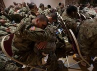 A trainee attempts to get a little sleep as he waits for transportation at the Joe E. Mann Ballroom Dec. 18. He is one of thousands of Initial Entry Training Soldiers across the Army who are headed home on leave for the holidays.