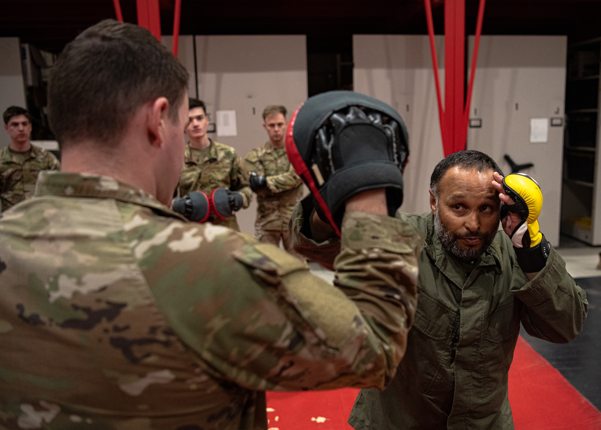 A U.S. Air Force Air Commando with the 27th Special Operations Wing (left) practices basic combat techniques with a field skills instructor with the 371st Special Operations Combat Training Squadron (right) during the Special Operations Task Unit-192 course at Cannon Air Force Base, N.M., Oct. 27, 2023. The course curriculum included medical response training, radio communications and combat exercises. (U.S. Air Force photo by Staff Sgt. Vernon R. Walter III)