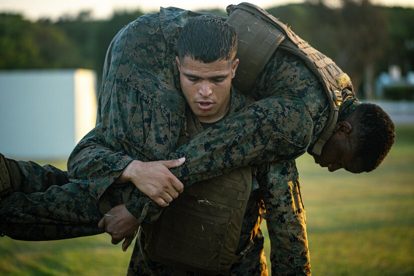 A Marine carries another.