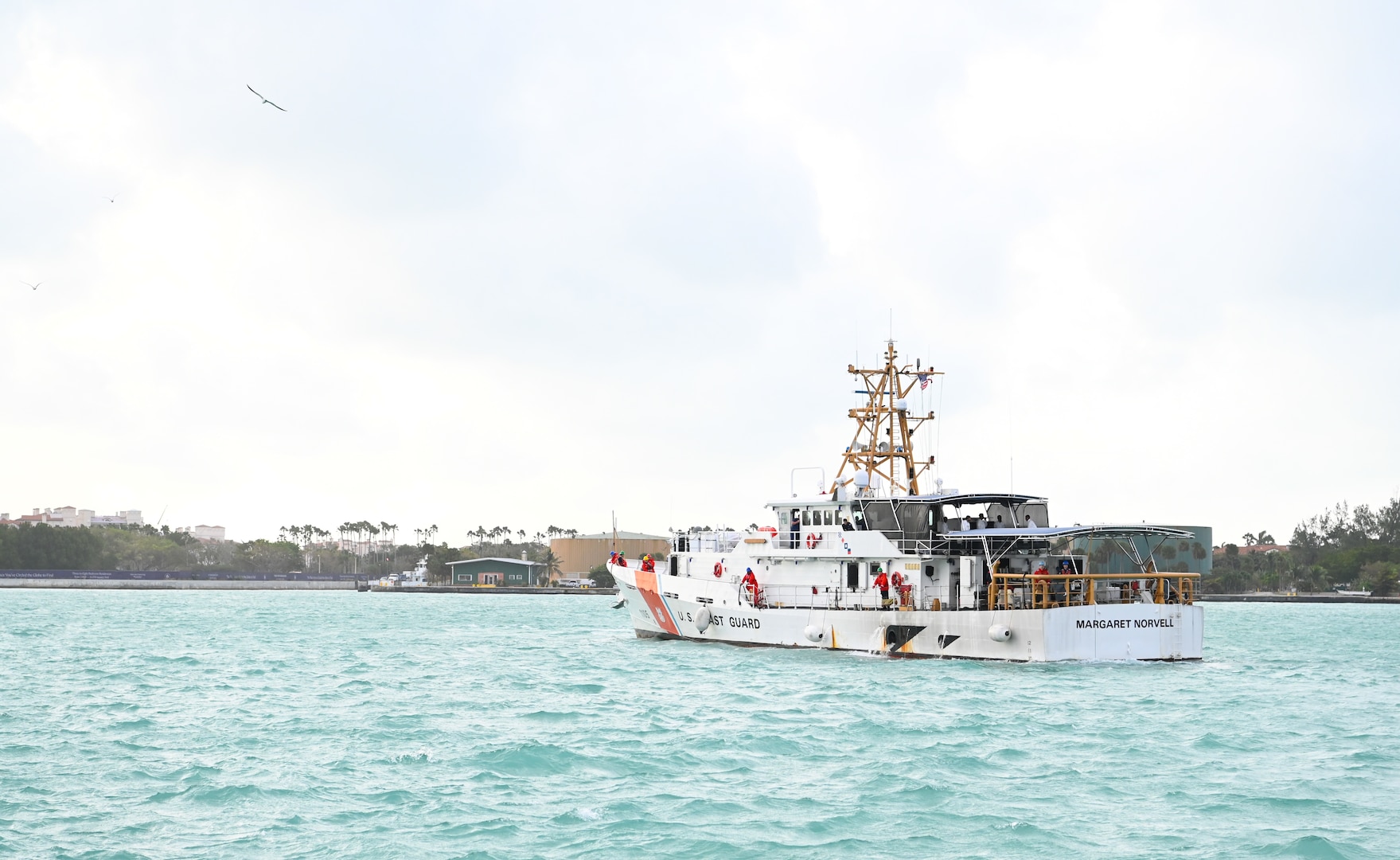 The crew of Coast Guard Cutter Margaret Norvell prepares to moor at Coast Guard Base Miami, Jan. 9, 2024.