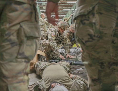 U.S. Army Reserve Soldier opens a liter during Combat Lifesaver Course